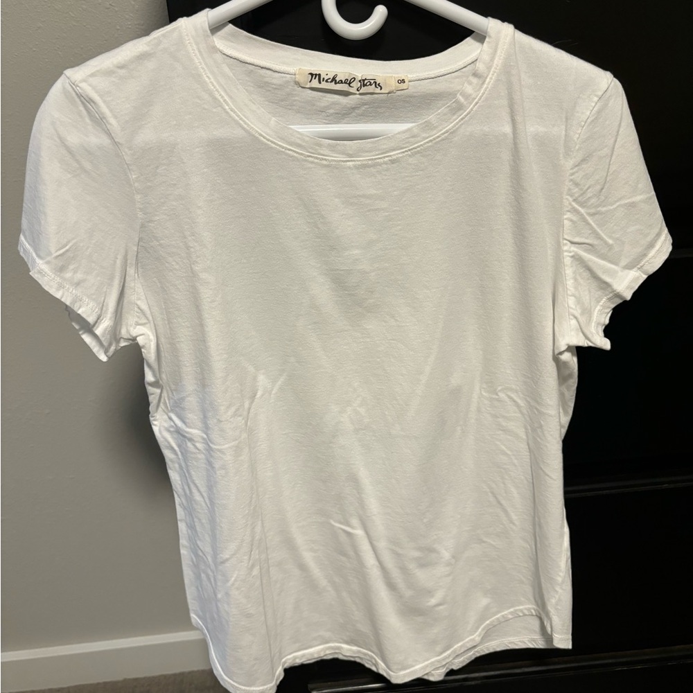 Michael stars white tee.